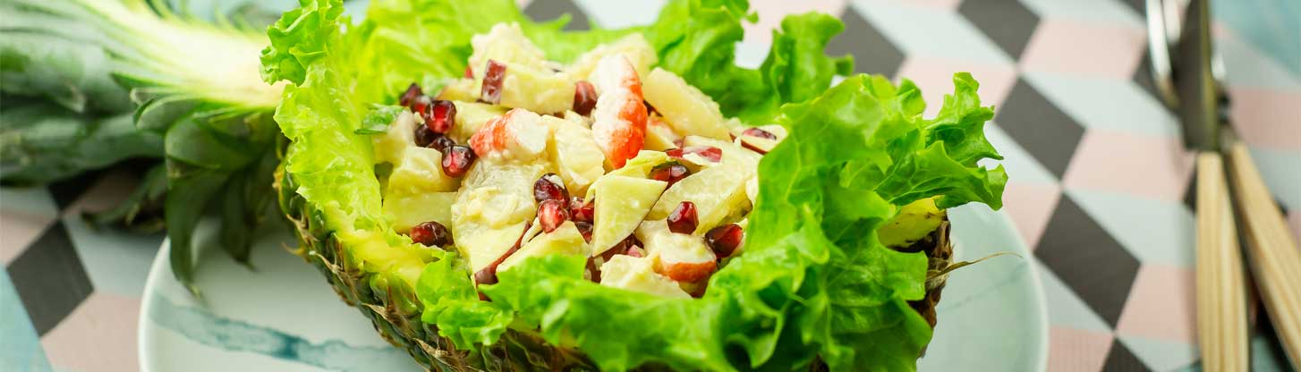 Pineapple salad with fruit and crab meat