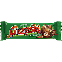 "Grzeski orzechowe"" Waffel mit Haselnussgeschmack-Creme (48%) in Milchschokolade. Schokolade enthält neben Kakaobutter auch andere pflanzliche Fette.